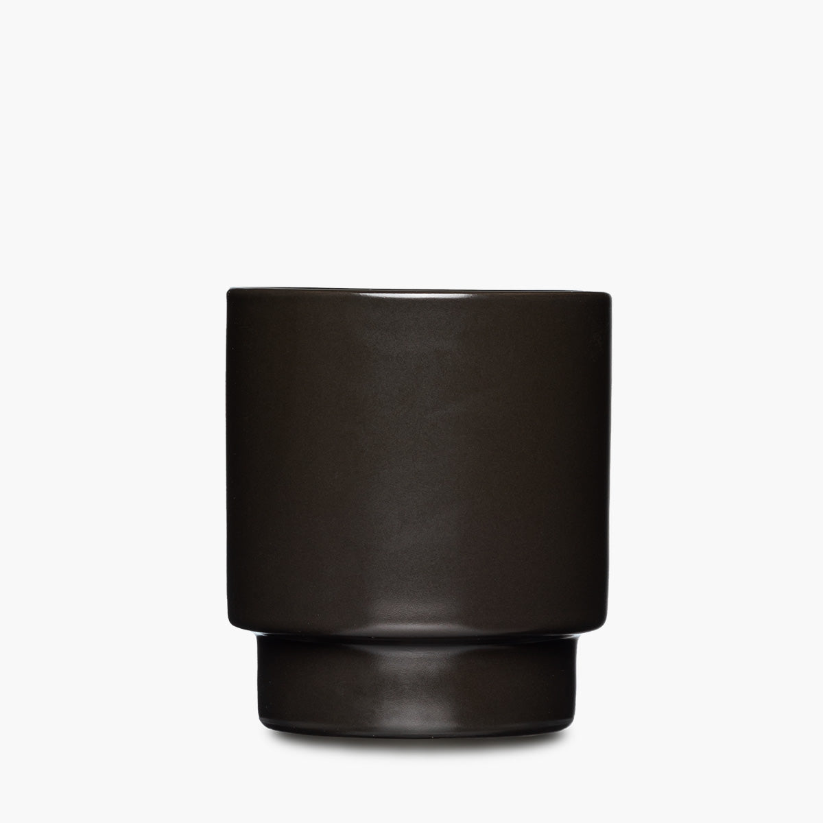 A matte black ceramic tumbler with a matte finish and a flared base, centered.
