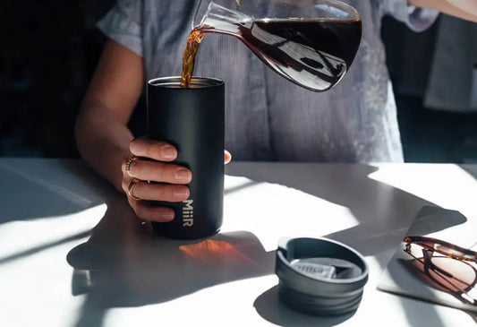 Pouring coffee into a MiiR Flip Traveler