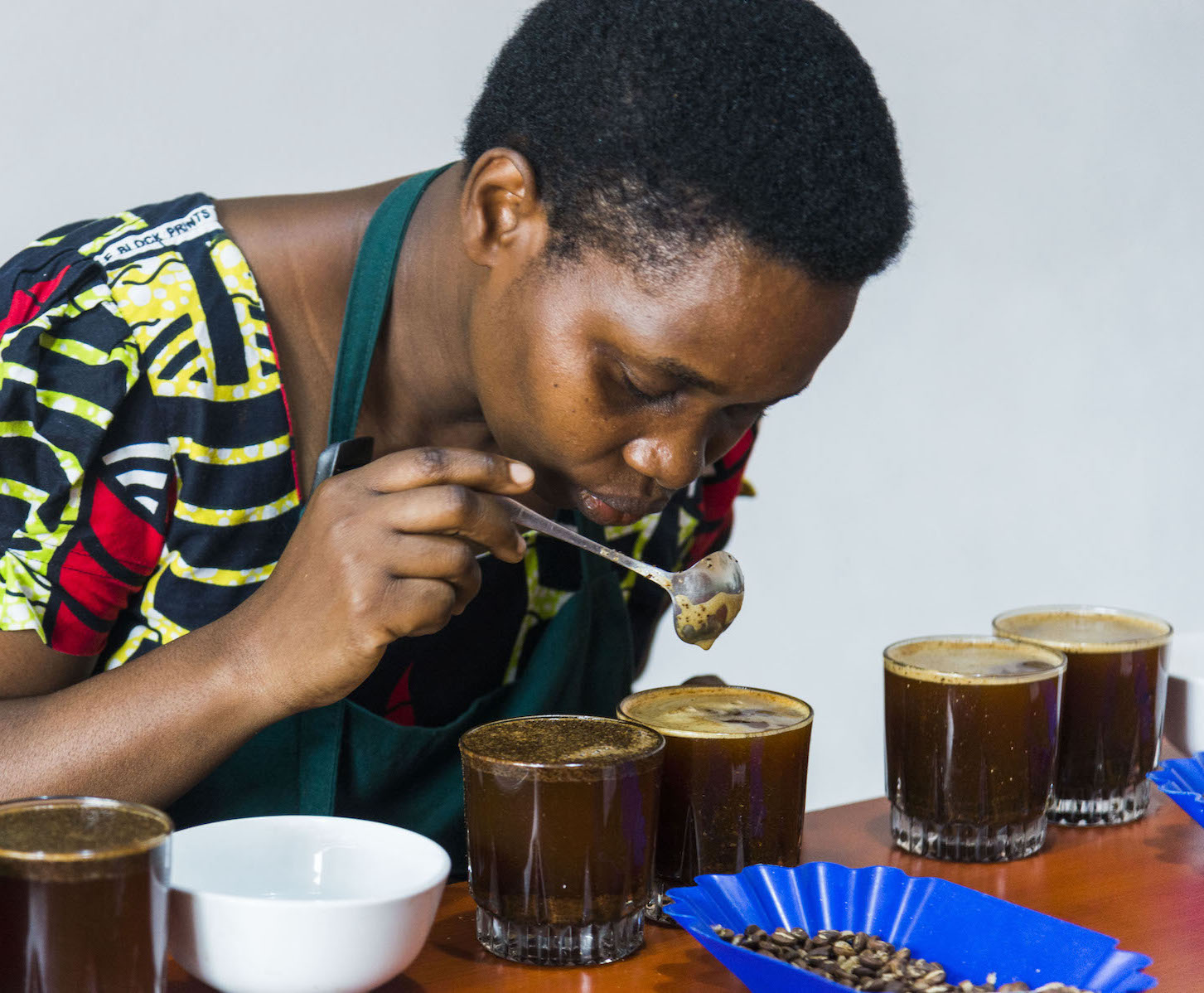 IWCA Rwanda person coffee cupping