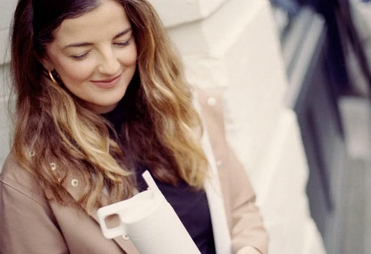 Woman holding a MiiR Straw Bottle